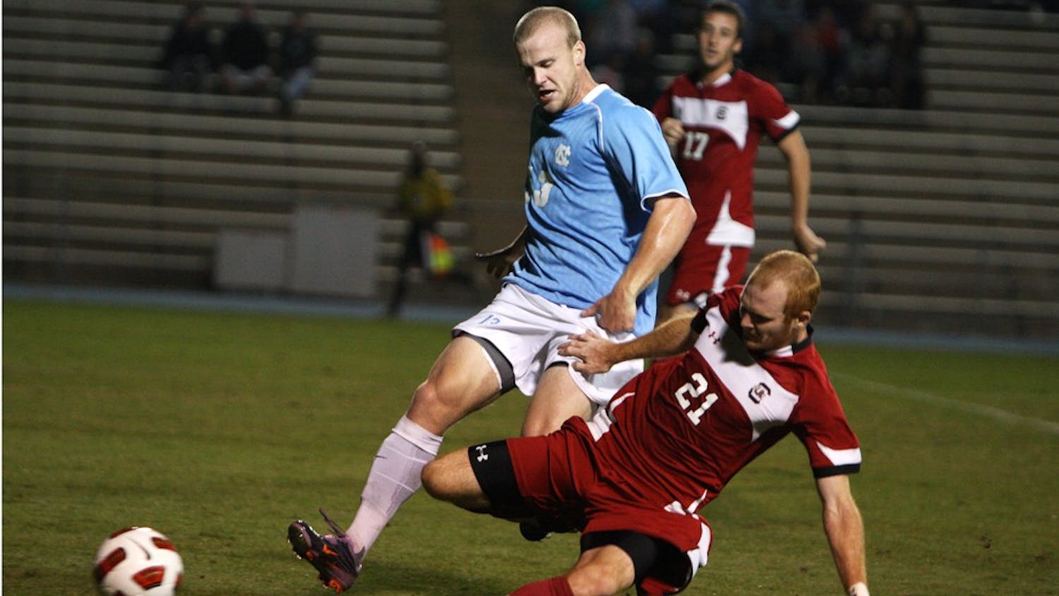 Redshirt freshman Josh Rice is taken down by South Carolina defender Danny Cates. The match featured seven yellow cards, four by South Carolina, and two red cards that were split between the two squads.