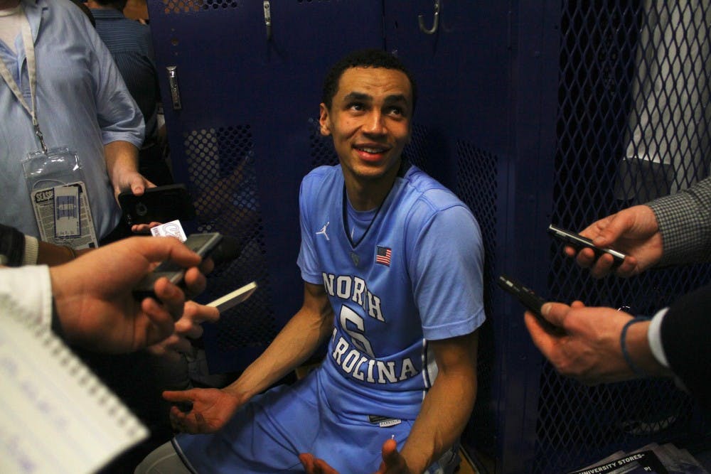 Marcus Paige (5) laughs while talking with the media in the locker room after the team's 76-72 victory over Duke.&nbsp;