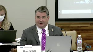 Chairperson James Holmes Jr. speaks at the Board of Governors' Committee on Budget and Finance meeting on Wednesday to address fundings allocated for COVID-19, adjustments for tuition for in-state and out-of-state students next year and school fees.&nbsp;