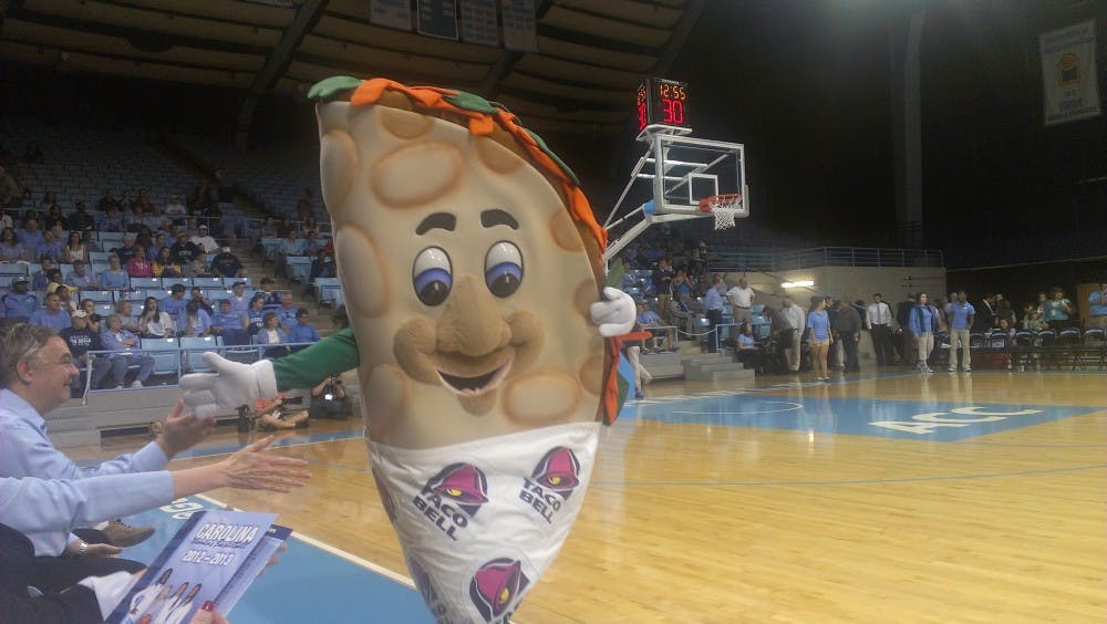 	<p>The Taco Bell Taco greets fans before a halftime showdown against its fellow mascots.</p>