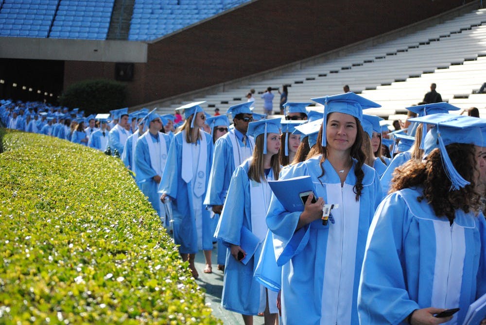 <p>Seniors line up to walk onto Kenan Stadium for their Spring Commencement Sunday, March 8, 2016.&nbsp;</p>
