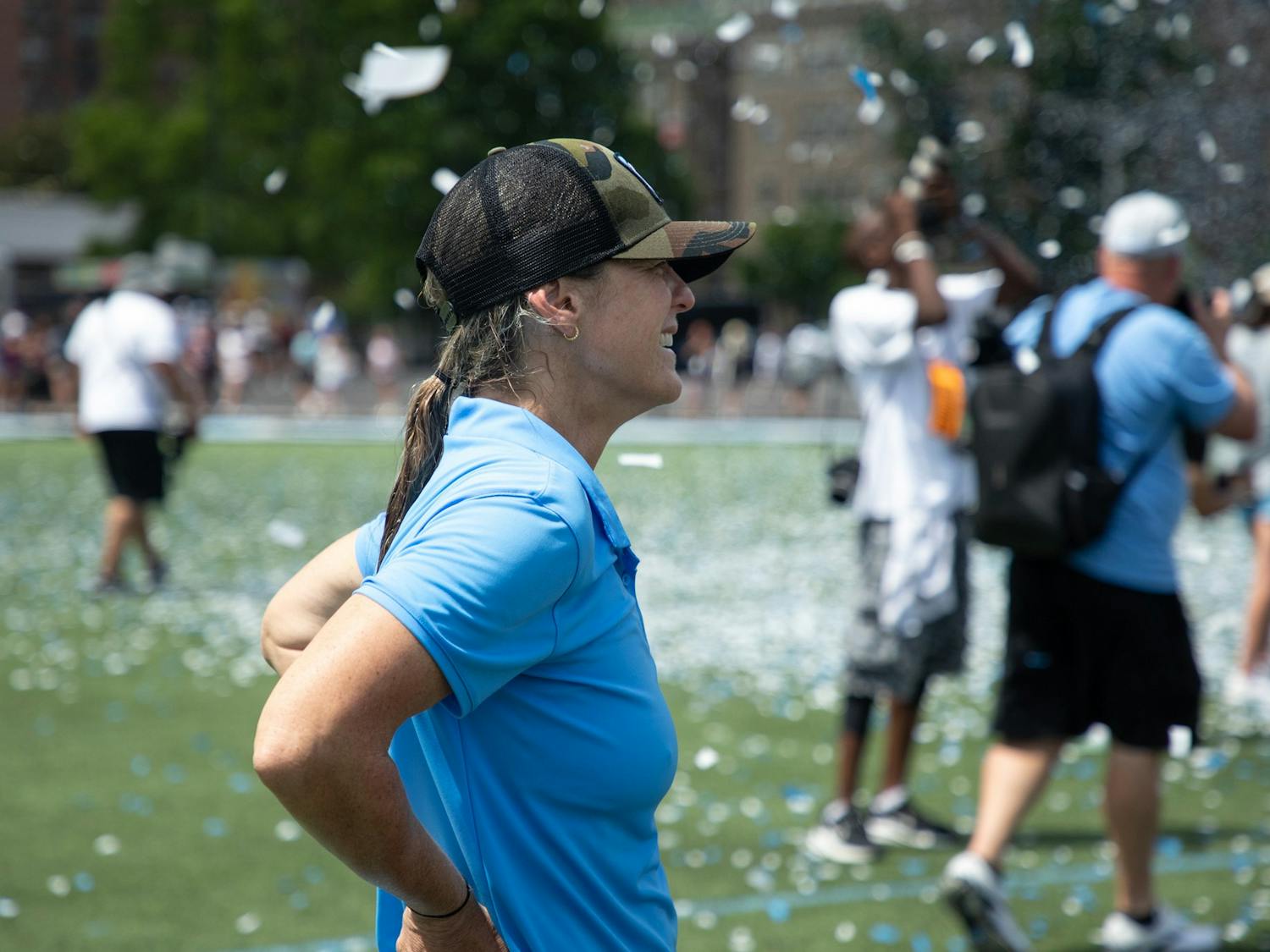Head coach Jenny Levy smiles as her team celebrates their NCAA Tournament championship victory. UNC beat Boston College 12-11 at Homewood Field in Baltimore, Md. on Sunday, May 29, 2022.