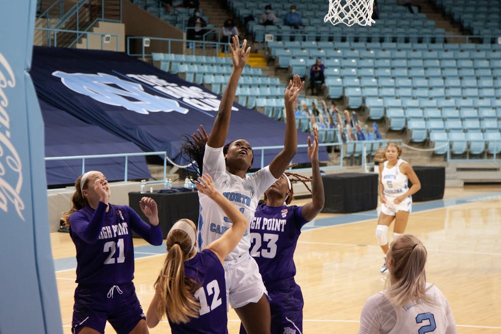 UNC first year forward Anya Poole (31) attempts a put-back shot during Carolina's 95-70 victory over High Point at Carmichael Arena on November 29th, 2020.
