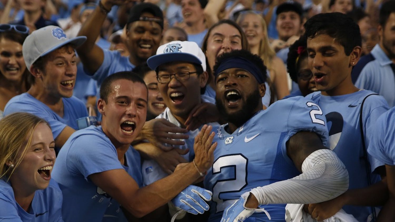 UNC senior cornerback Des Lawrence (2) celebrates the football team's last second victory over Pittsburgh with fans&nbsp;on Sep. 24.