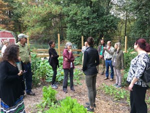 Food Council members and elected officials learn about the importance of school gardens at a school garden tour at Estes Hill Elementary led by the CHCCS Sustainability Director Dan Schnitzer. Photo courtesy of Ashley Heger.&nbsp;