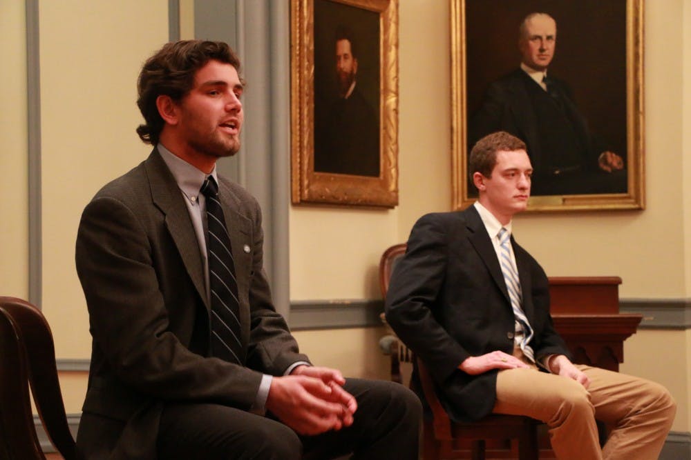 <p>Wilson Sink (left) and John Taylor participate in a Student Body President debate hosted by Di Phi.&nbsp;</p>