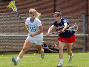 UNC senior attacker Scottie Rose Growney (15) runs with the ball at the quarterfinals of the NCAA tournament against Stony Brook at the Dorrance Field in Chapel Hill on Saturday May 22, 2021. The Tar Heels won 14-11.