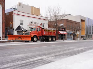 A snow truck drives down Franklin Street on Sunday, Jan. 16, 2022.
