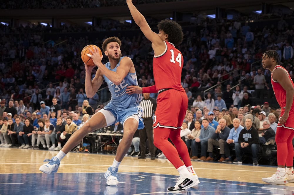 UNC graduate forward Pete Nance (32) continues to help the Tar Heel offense after scoring the points that carried them into overtime during the men's basketball game against Ohio State at Madison Square Garden on Saturday, Dec. 17, 2022. UNC beat Ohio State 89-84.