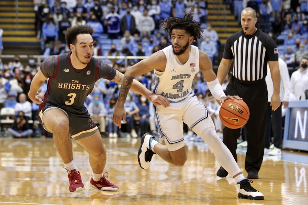 Sophomore guard RJ Davis (4) runs with the ball at the game against Boston College at the Smith Center on Jan. 26, 2022.