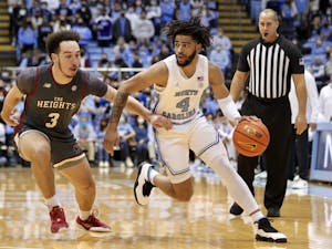 Sophomore guard RJ Davis (4) runs with the ball at the game against Boston College at the Smith Center on Jan. 26, 2022.