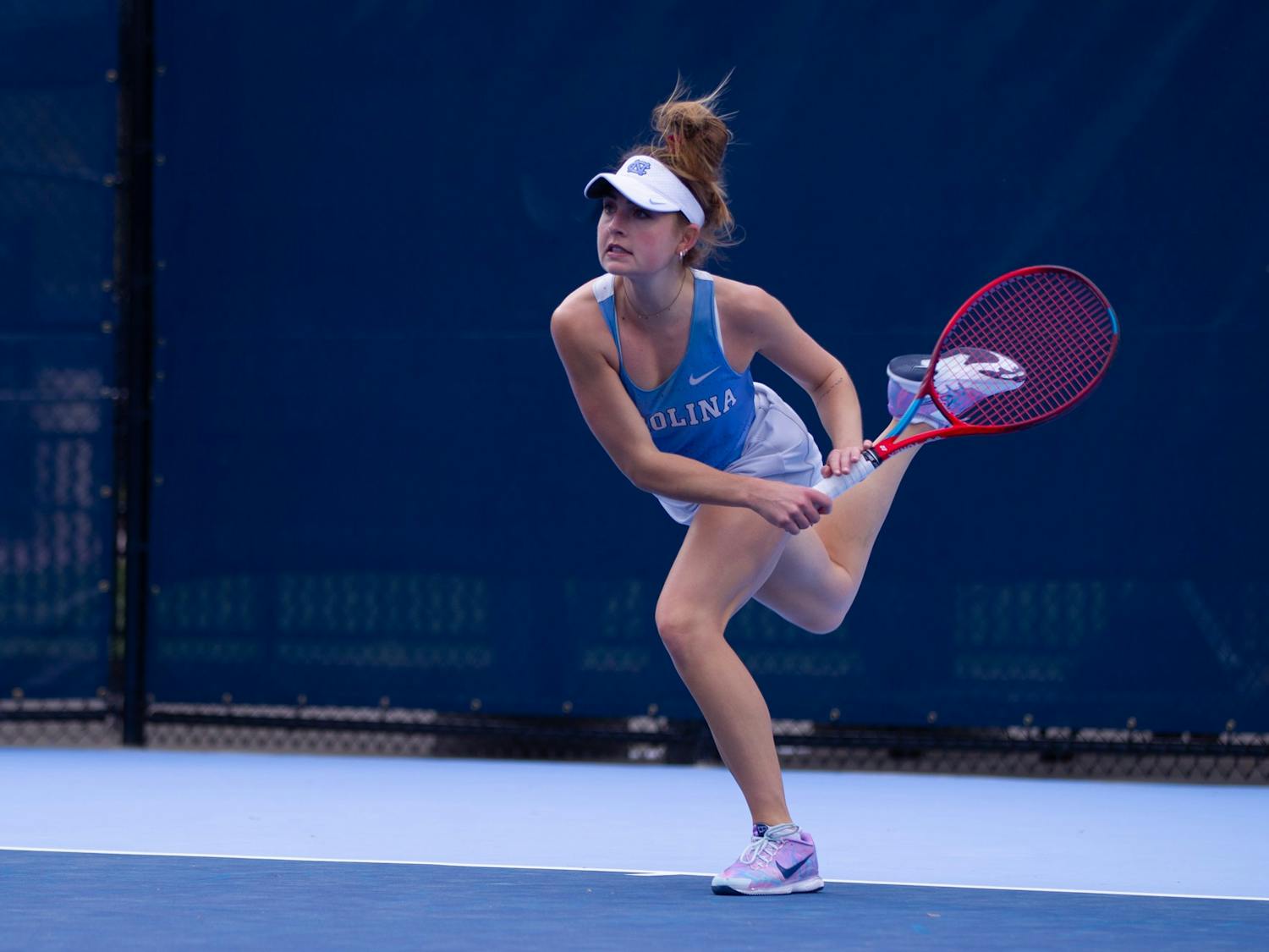 UNC junior Fiona Crawley serves during a match against Florida State University at the Cone-Kenfield Tennis Center on Friday, March 31, 2023. The Tar Heels won 6-1.