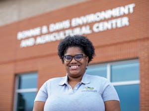 Kalini Allen, an administrative support associate at DEAPR and a coordinator for the Nature of Orange Photo Contest, poses for a portrait outside the Bonnie B. Davis Environment and Agricultural Center in Hillsborough, N.C., on Monday, Feb. 21, 2022.