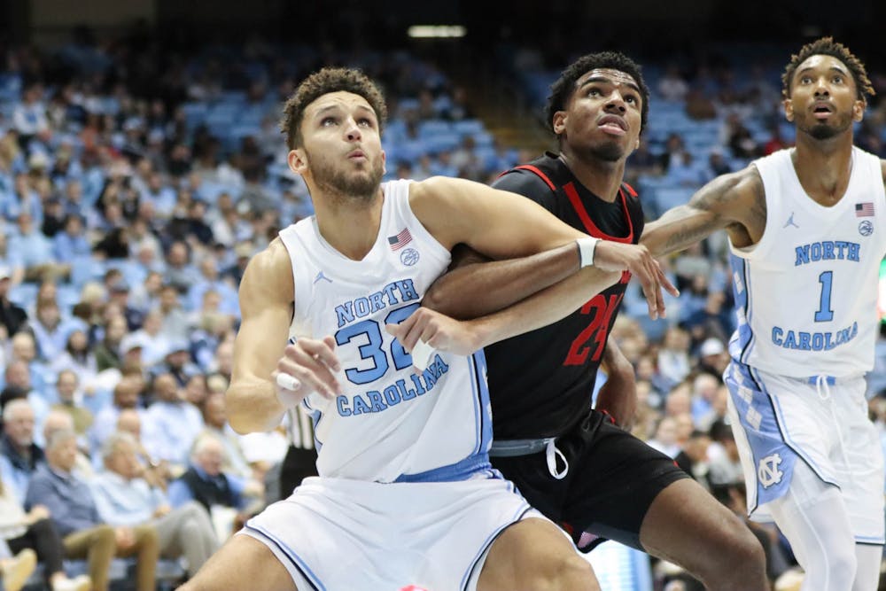 UNC graduate forward Pete Nance (32) boxes out a Gardner-Webb player during the men's basketball game against Gardner-Webb at the Dean Smith Center on Tuesday, Nov. 15, 2022. UNC beat Gardner-Webb 72-66.
