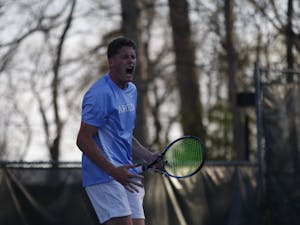 UNC men's tennis senior Blaine "Bo" Boyden celebrates after winning a match during a singles set against NC State on Wednesday April 3, 2019. UNC beat NC State 4-0.&nbsp;
