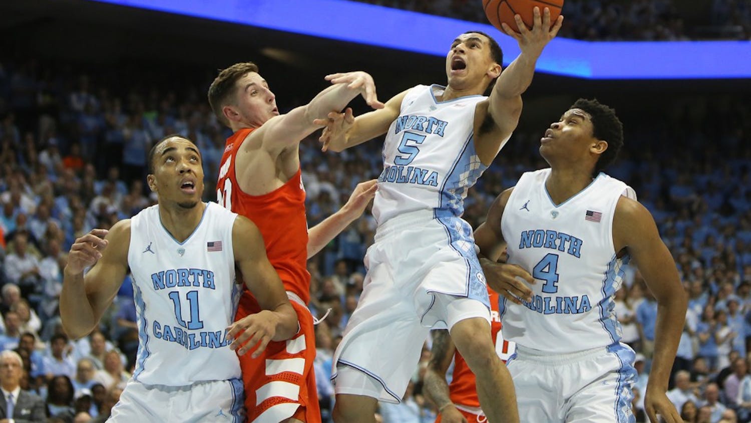 Senior Marcus Paige (5) goes up for a layup during Monday night’s home game.