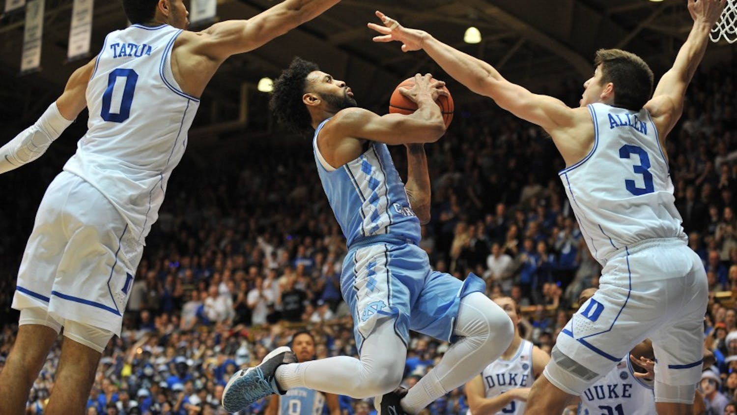 North Carolina guard&nbsp;Joel Berry (2) is blocked by two Duke defenders during the second half of the game on Thursday evening.&nbsp;