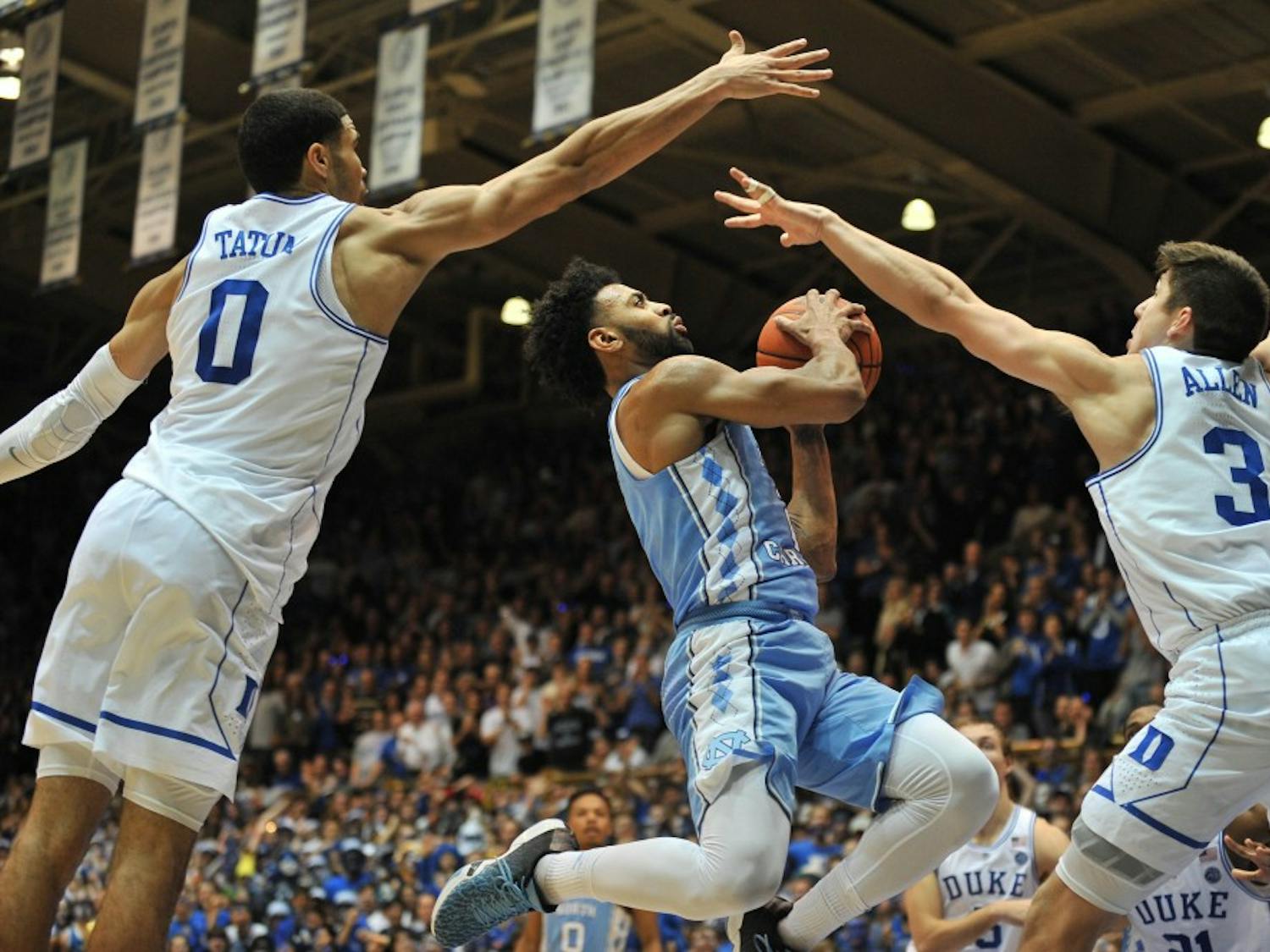 North Carolina guard&nbsp;Joel Berry (2) is blocked by two Duke defenders during the second half of the game on Thursday evening.&nbsp;