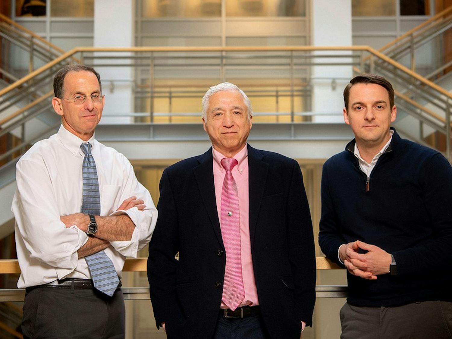 UNC-Chapel Hill HIV researchers David Margolis, MD, and J. Victor Garcia, PhD, along with Rick Dunham from ViiV Healthcare (from left to right). Margolis is director of the UNC HIV Cure Center, which is home to Qura Therapeutics, a company formed through a partnership between UNC-Chapel Hill and ViiV, formerly the HIV research wing of GSK.
Photographed January 21, 2020 at the Genetic Medicine Building on the campus of the University of North Carolina at Chapel Hill. Photo courtesy of Jon Gardiner/UNC-Chapel Hill.