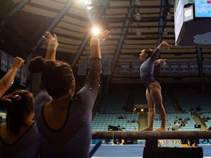 UNC first-year Lali Dekanoidze performs a beam routine during UNC gymnastics' home meet against Temple University on Saturday, Feb. 12, 2022.