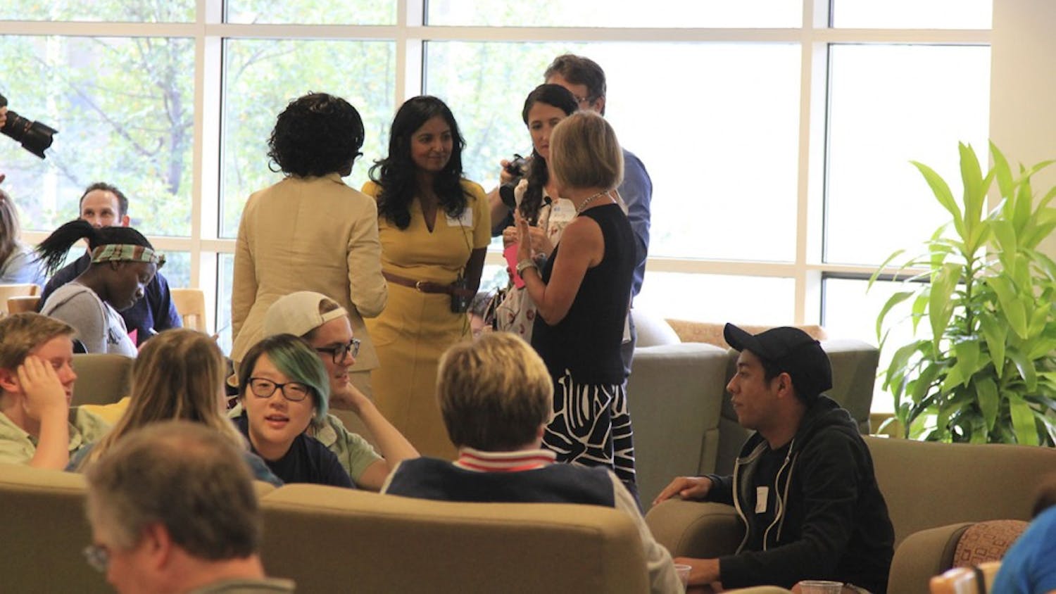 Rumay Alexander (far left), Dr. Viji Sathy (left),  Dr. Kelly Hogan (right), and Chancellor Carol Folt converse at the Carolina Conversations while students, faculty, and staff do the same in small groups on Monday in the Aquarium Lounge at the Student Union. 