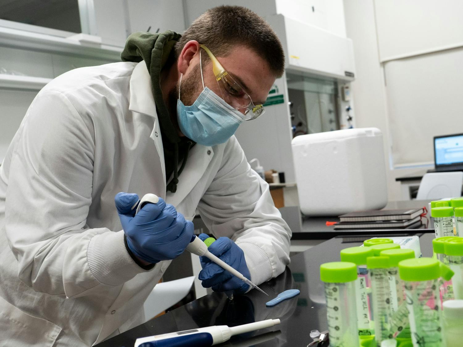 Senior chemistry major Stephen Klawa tests the GlycoGrip COVID-19 test strip at the Freeman Lab on Jan. 10, 2022.