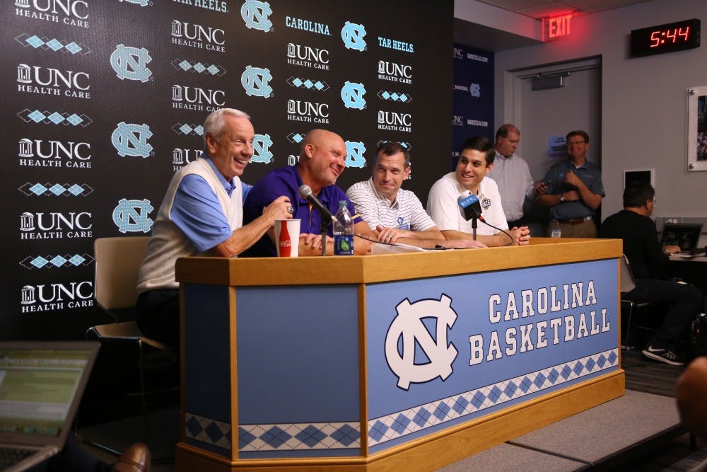 Roy Williams and old teammates/assistant coach