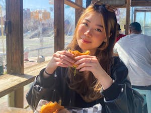 Aiko Rachel Peterson eats a burger at Al's Burger Shack on Feb. 24, 2023. Photo Courtesy of Aiko Rachel Peterson.
