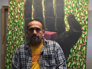 Renzo Ortega sits in his Carrboro studio. He is one of many Orange County artists and musicians who have experienced lifestyle changes as a result of COVID-19. The Orange County Arts Support Fund seeks to assist these artists through community donations. Photo courtesy Renzo Ortega. 
