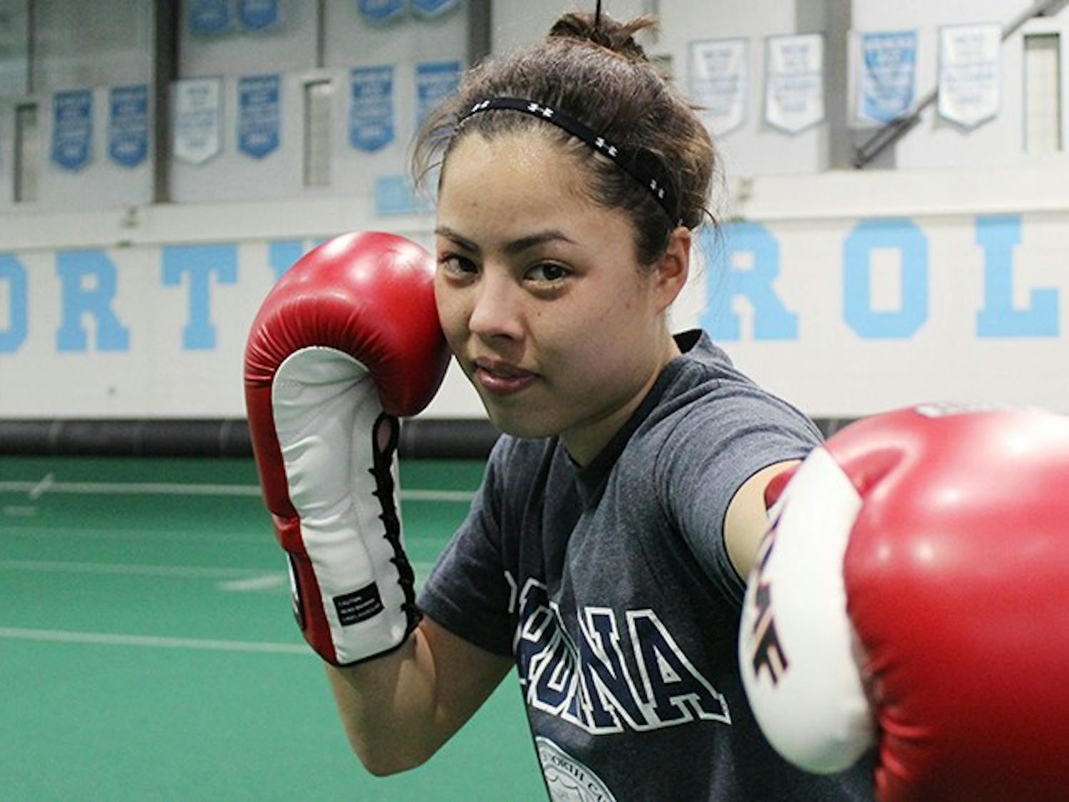 UNC Boxer and National Champion, Michelle Kern, posing after practice