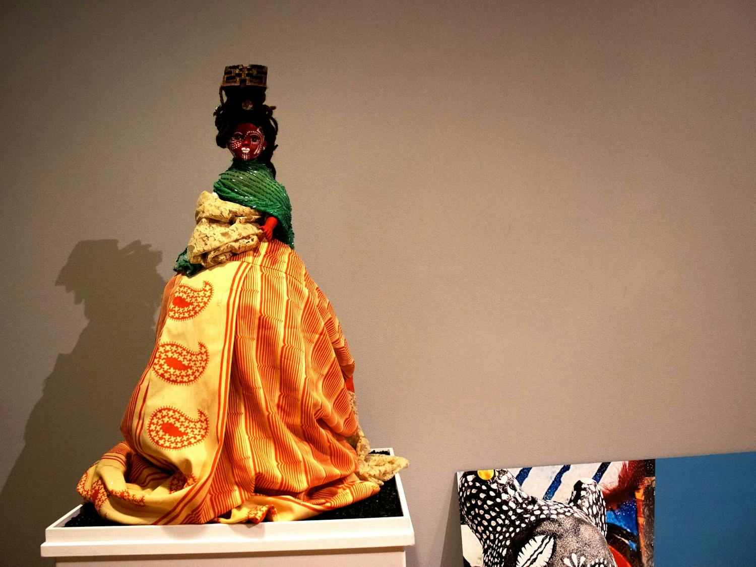 A doll on display in Stone Center's Brown gallery as a part of Anike Robinson's Gris Gris Gurlz exhibition, photographed on Monday, Sept. 19, 2022.
