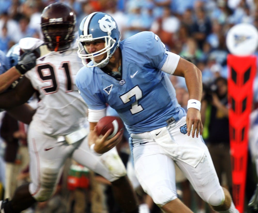Former UNC quarterback Mike Paulus runs the ball in a 2008 game against Virginia Tech. Now he’s known as
Michael and plays for William &amp; Mary, who visits Chapel Hill on Saturday. The Tribe is 3-0 in games he starts.