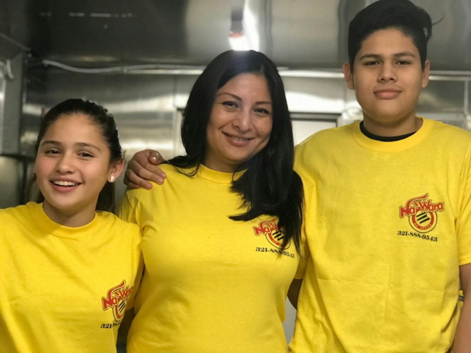 Patricia Fidhel poses with her children, Leonardo and Alexandra, inside their arepa food truck. Photo contributed by David Moncada.