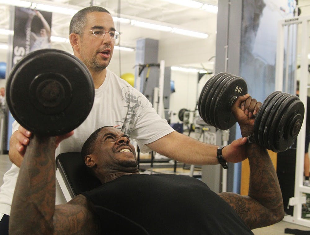 	Jonas Sahratian spots former UNC forward Marvin Williams during a workout at the weight room in the Smith Center Tuesday morning.