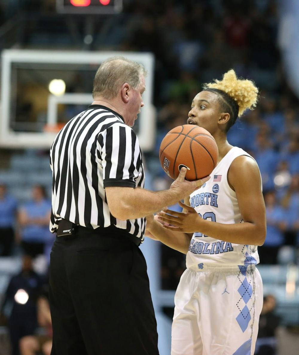 Senior guard Paris Kea (22) talks with a referee during a game against Notre Dame in Carmichael Arena on Sunday, Jan. 27, 2019. UNC won 78-73.