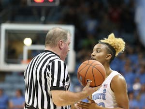 Senior guard Paris Kea (22) talks with a referee during a game against Notre Dame in Carmichael Arena on Sunday, Jan. 27, 2019. UNC won 78-73.