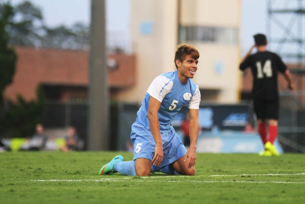 UNC forward, Alan Winn, smiles after a near miss on goal during the first half.  He finished with a goal by match end.  UNC defeated Gardner-Webb 7-0 Friday night at Fetzer field in an exhibition game.