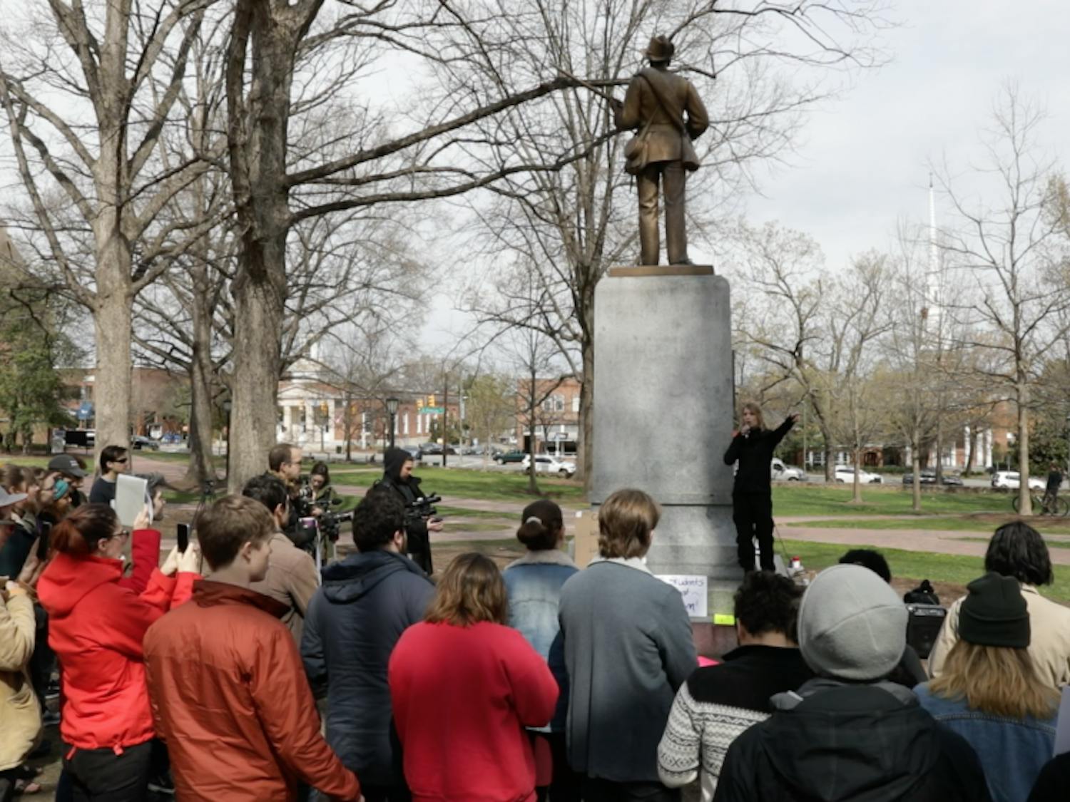 Chelsea Manning gives a speech in front of the Silent Sam monument during a rally on Saturday afternoon.
