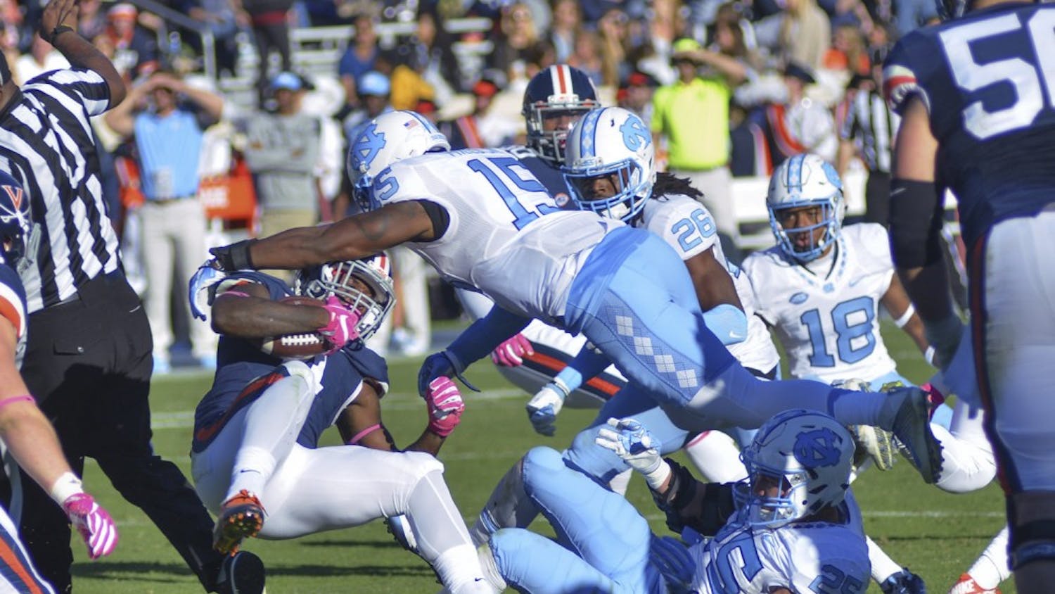 Donnie Miles (15) tackles a Virginia player. UNC defeated UVA 35-14 on Saturday, October 23.