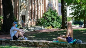 Students enjoy the outdoors while wearing masks and staying social distant at Polk Place on Sunday, Sept. 6, 2020.