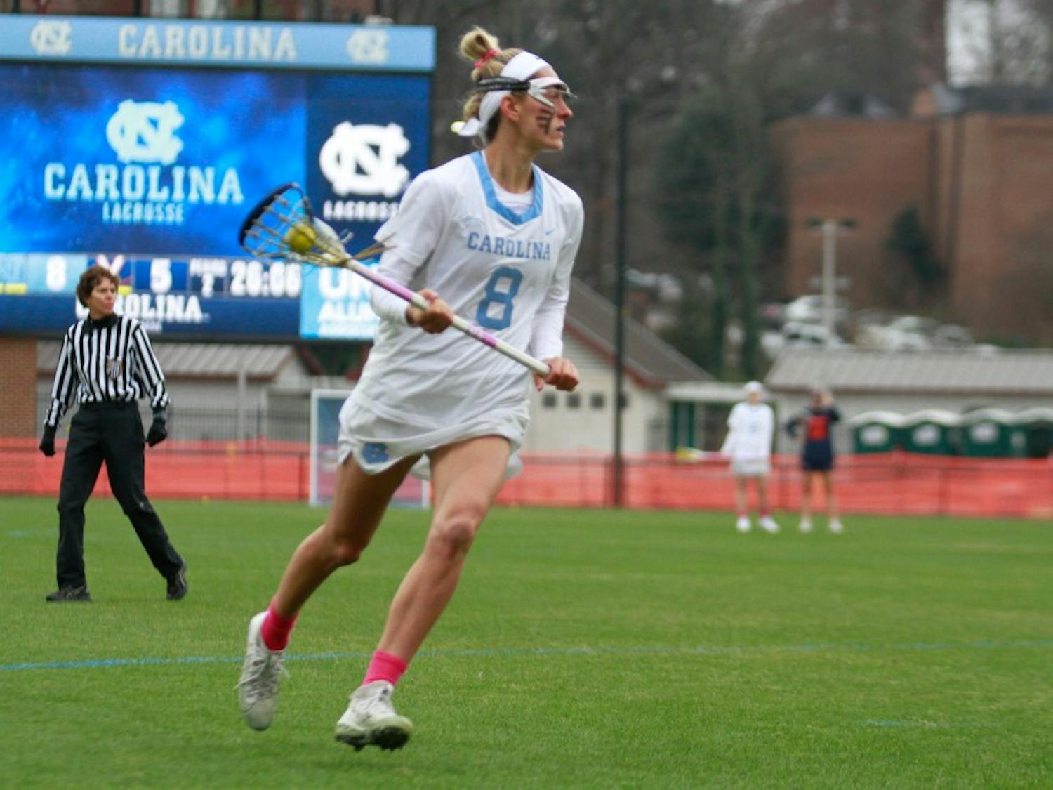 Team captain and third-year attacker Katie Hoeg (8) plays during ACC kick-off game against UVA. UNC won 13-12 at Fetzer Field in Chapel Hill on March 9, 2019.