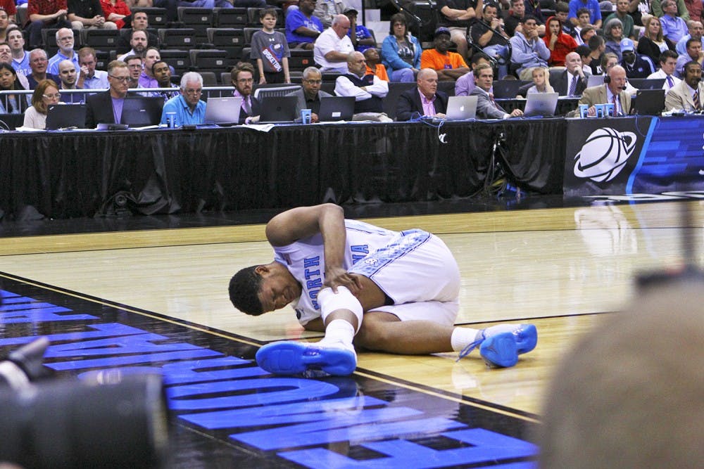 <p>Sophomore forward Kennedy Meeks injures his knee toward the end of the second half during Saturday's win over Arkansas.</p>