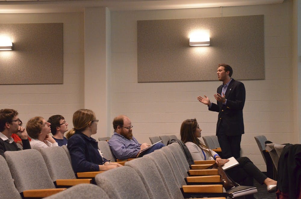 Dylan Russell, president of the Graduate and Professional Student Federation, updates members on their proposed separation from Student Congress on Tuesday in Rosenau Hall at the Gillings School of Global Public Health.