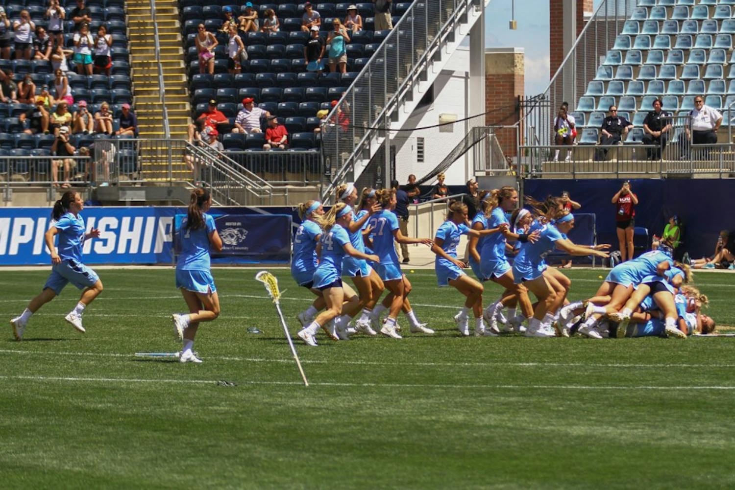 The North Carolina women's lacrosse team swarms goalkeeper Megan Ward after&nbsp;defeating Maryland 13-7 to capture the NCAA championship on Sunday at Talen Energy Stadium in Chester, PA.
