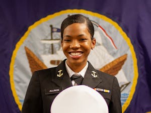 Kenya Allison poses for a portrait at the Naval Armory in Chapel Hill on Monday, Feb. 22, 2021 with her NROTC cap. Allison is the first Black female Battalion Commanding Officer for NROTC.