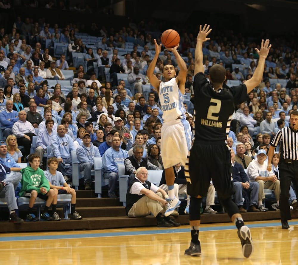 	North Carolina&#8217;s Marcus Paige attempts a 3-pointer in Friday&#8217;s season opener against Oakland.