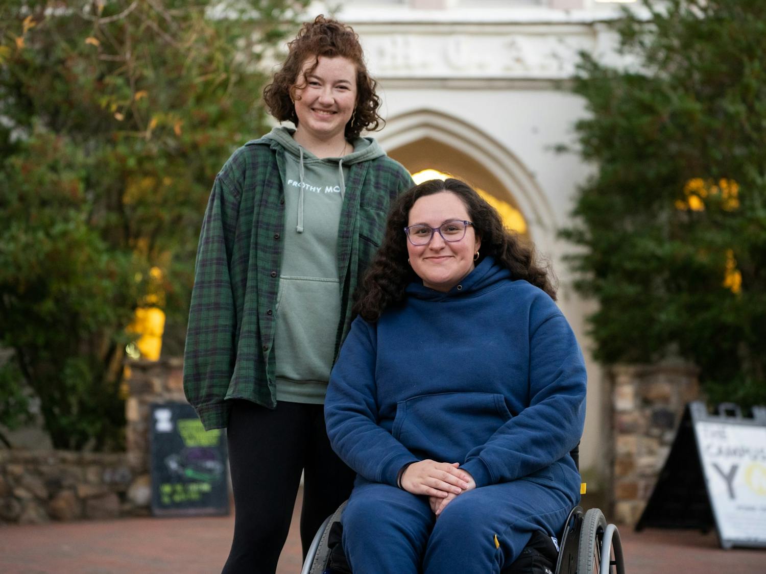 UNC senior Megan Murphy and sophomore Laura Saavedra Forero, the co-presidents of the Campus Y, pose in front of the Campus Y building on Monday, Nov. 14, 2022.