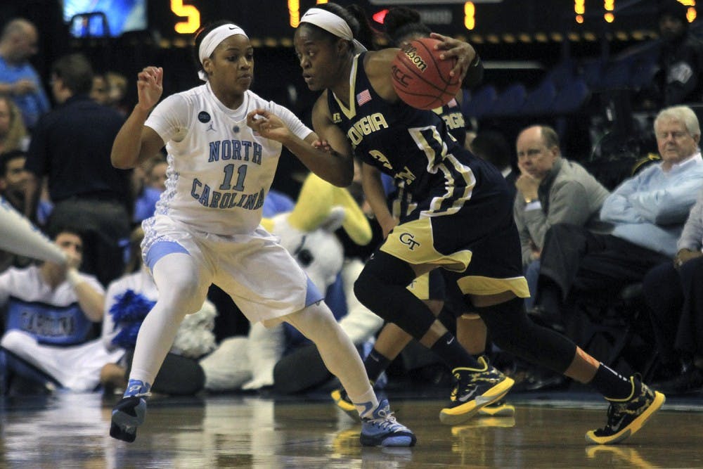 Brittany Rountree (11) attempts to guard Georgia Tech guard Kaela Davis (3). 