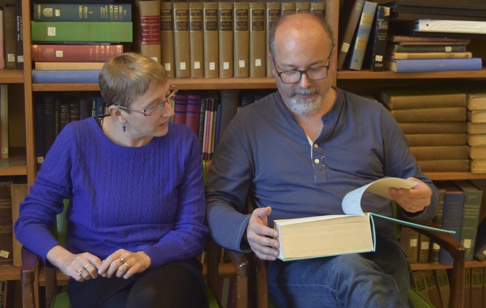 Jessica Wolfe (Director of Comparative Literature
Professor, English and Comparative Literature) and Reid Barbour (Professor of English) look over the first half of Reid's thesis that he wrote in 1982. 