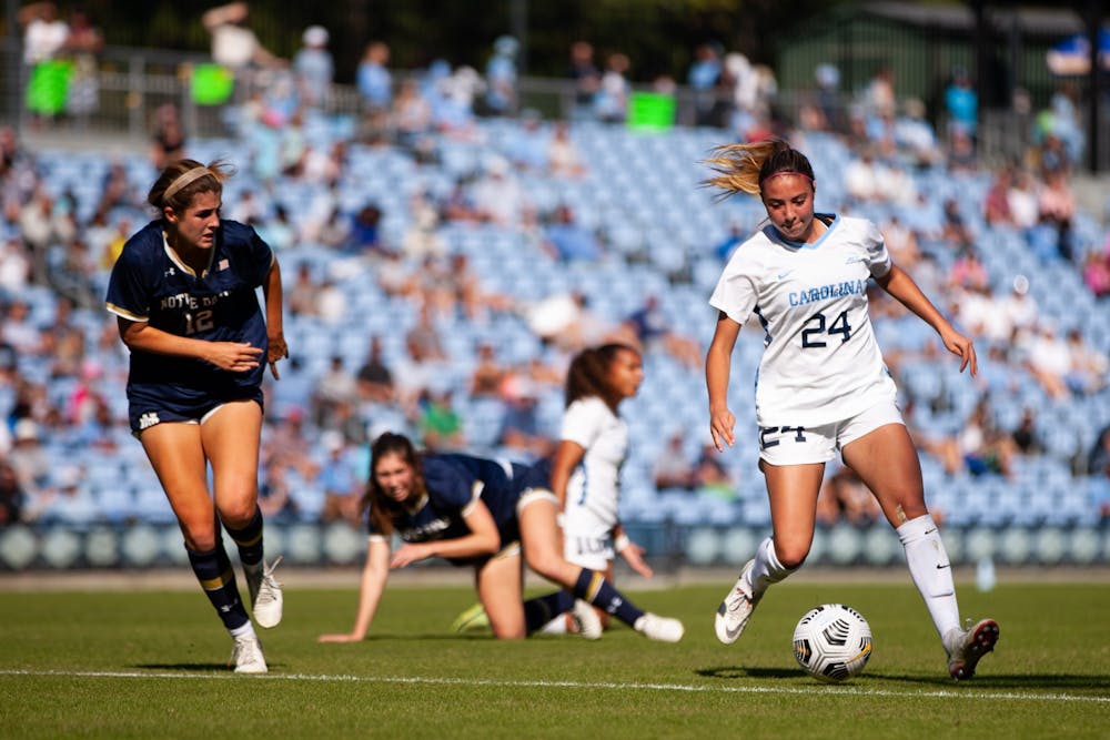 UNC sophomore midfielder Talia Dellaperuta (24) drives the ball down the field against Notre Dame on Oct. 24. The Tar Heels defeated the Fighting Irish 2-1 in overtime.
